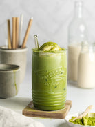 Whisked  organic matcha tea in a cup – natural energy boost and focus-enhancing superfood.